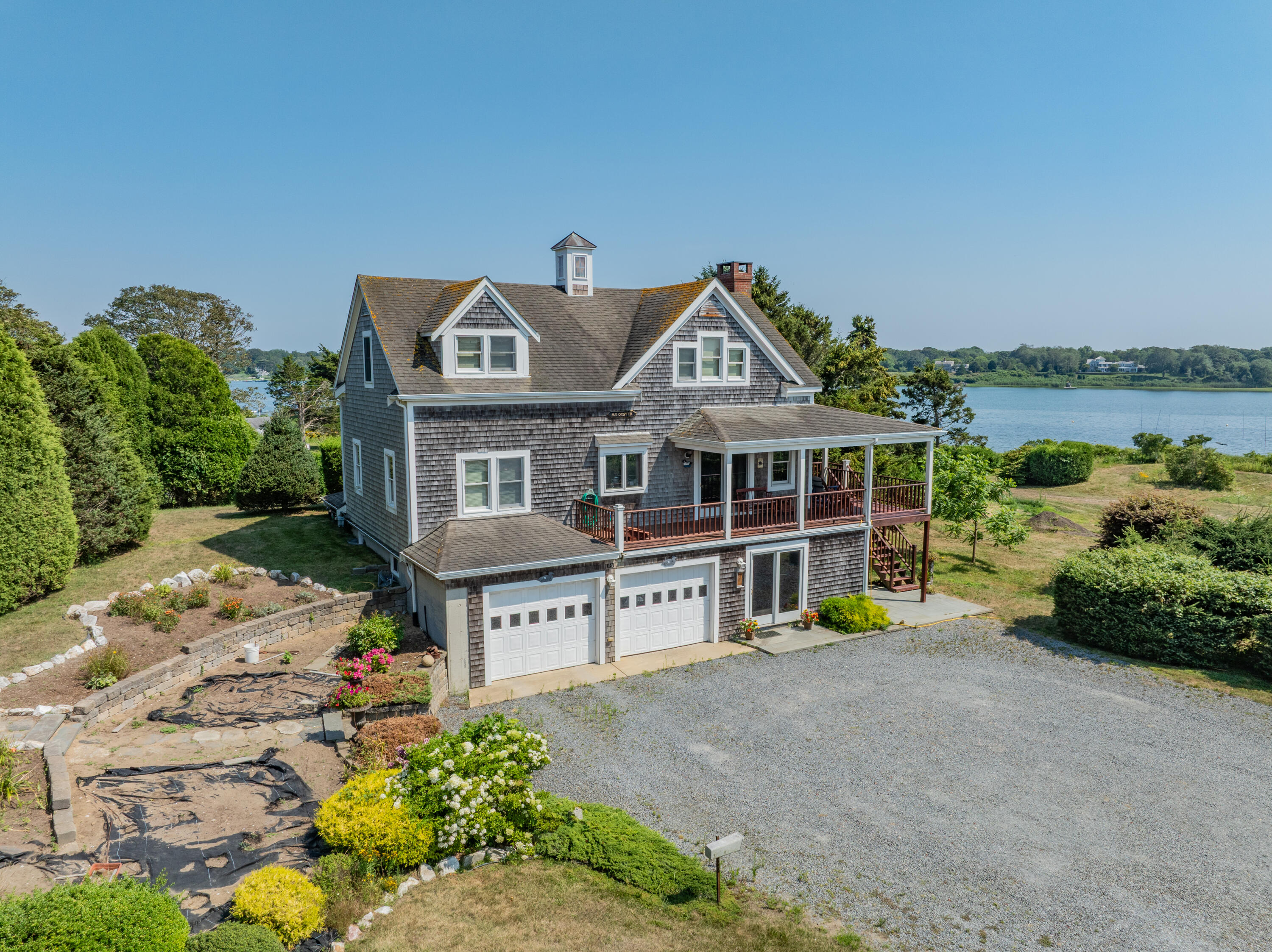 99 Uncle Alberts Drive Chatham, MA 02633 - Photo 6 of 32 a front view of a house with a yard