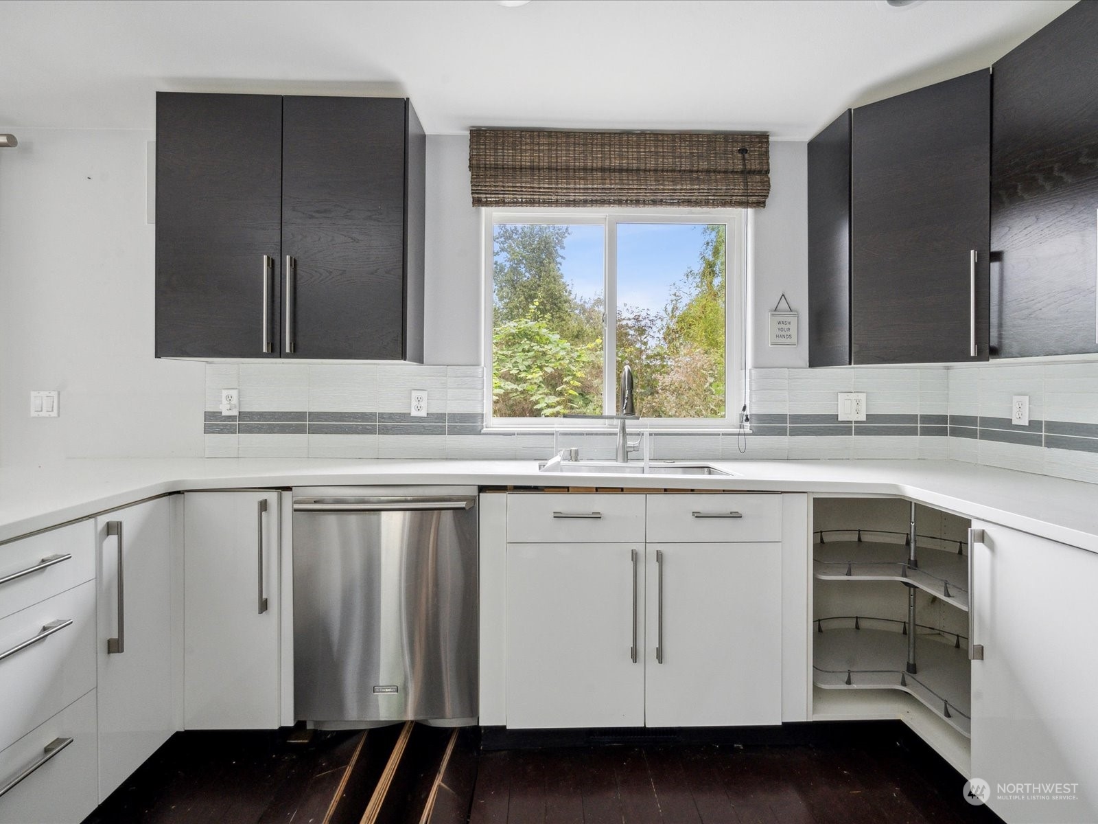 100 Torres Court Sequim, WA 98382 - Photo 11 of 26 a view with granite countertop cabinets sink and wooden floor