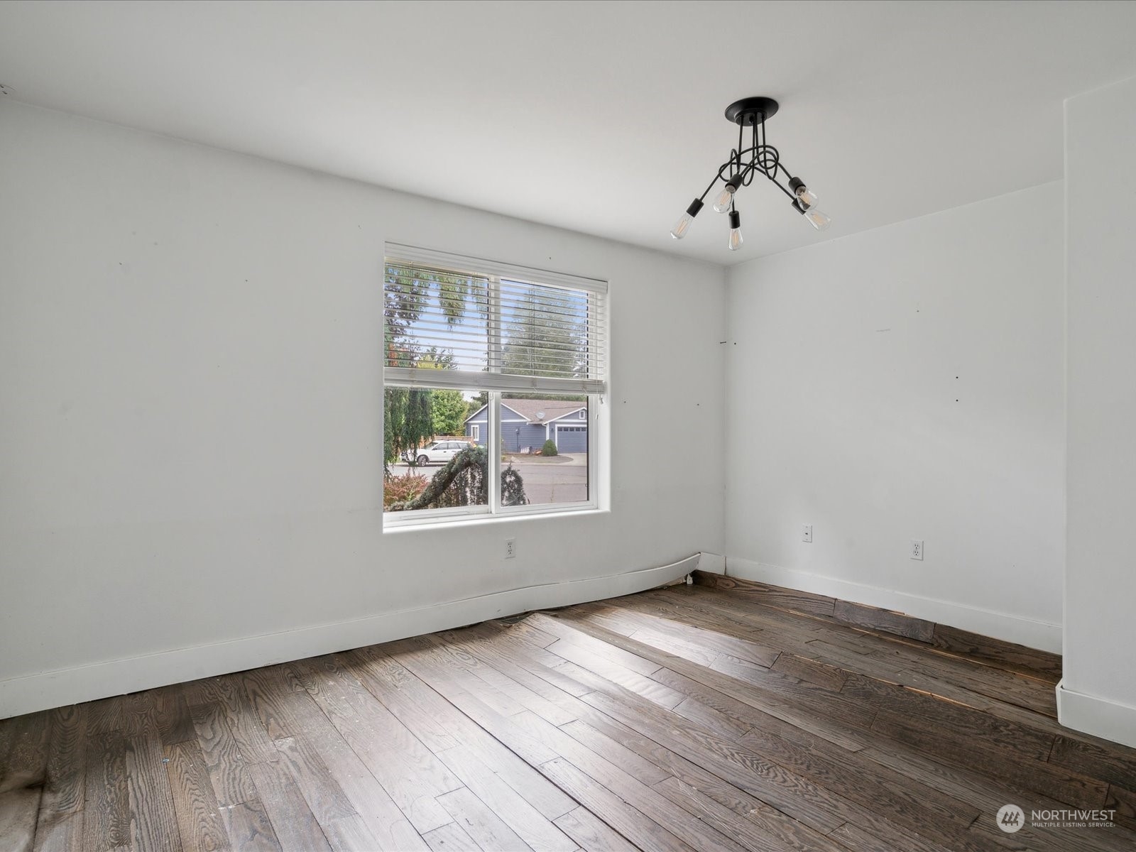 100 Torres Court Sequim, WA 98382 - Photo 15 of 26 wooden floor in an empty room with a window