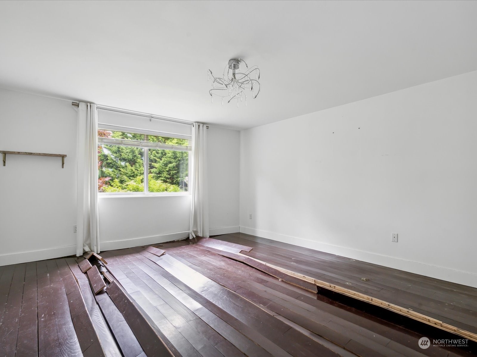 100 Torres Court Sequim, WA 98382 - Photo 20 of 26 wooden floor in an empty room with a window