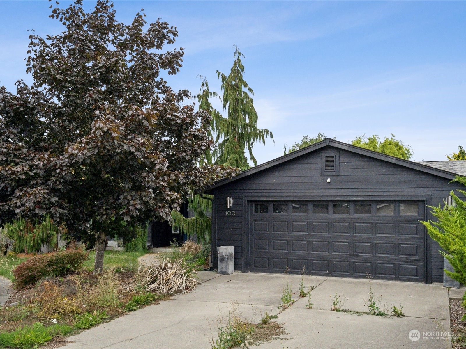 100 Torres Court Sequim, WA 98382 - Photo 2 of 26 a front view of a house with a yard