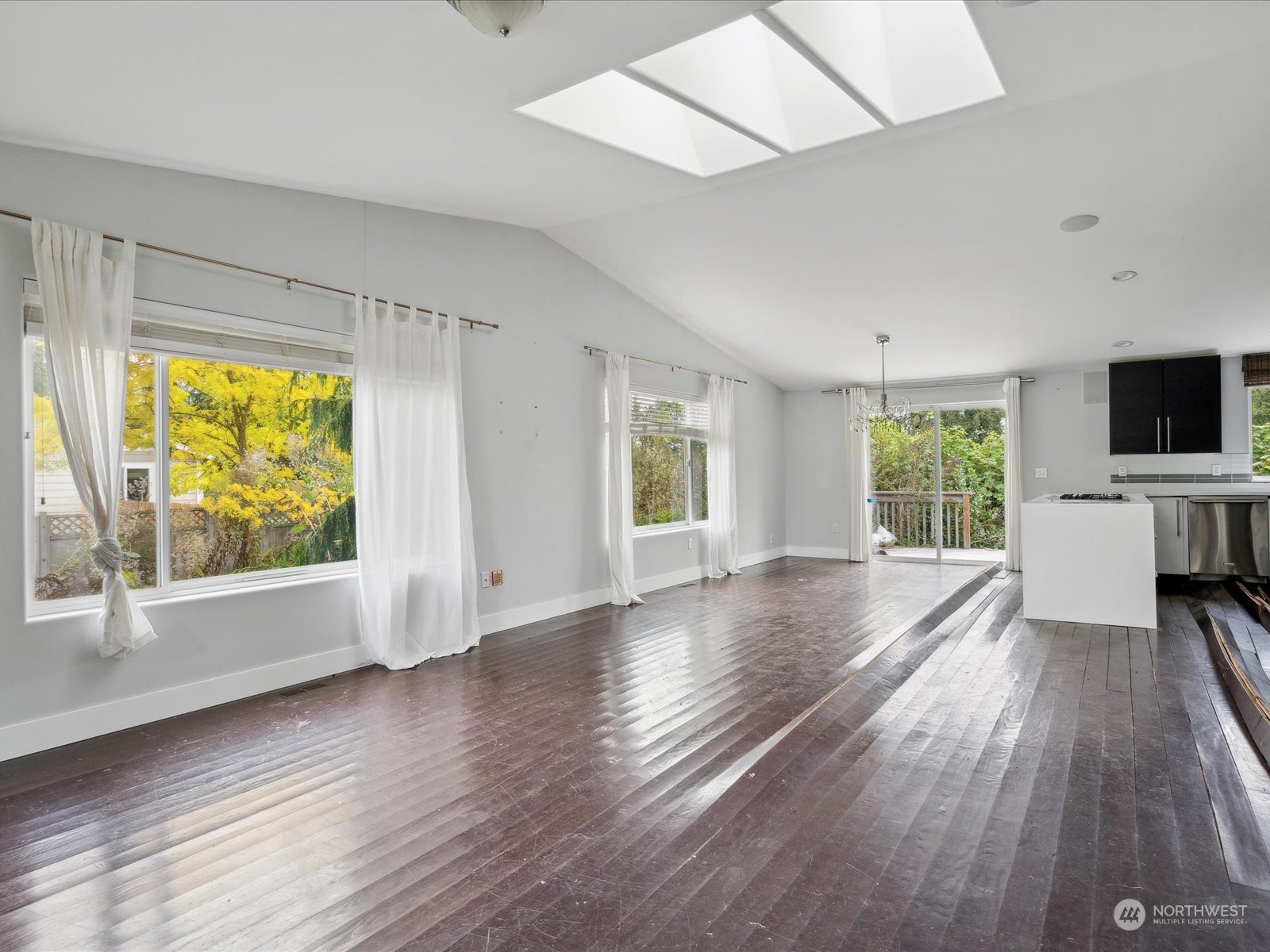 100 Torres Court Sequim, WA 98382 - Photo 8 of 26 wooden floor in an empty room with a window