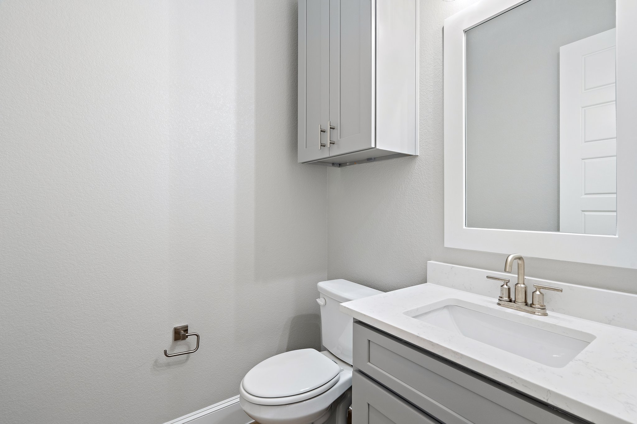 112 Axis Loop Georgetown, TX 78628 - Photo 18 of 39 a bathroom with a granite countertop toilet a sink and mirror