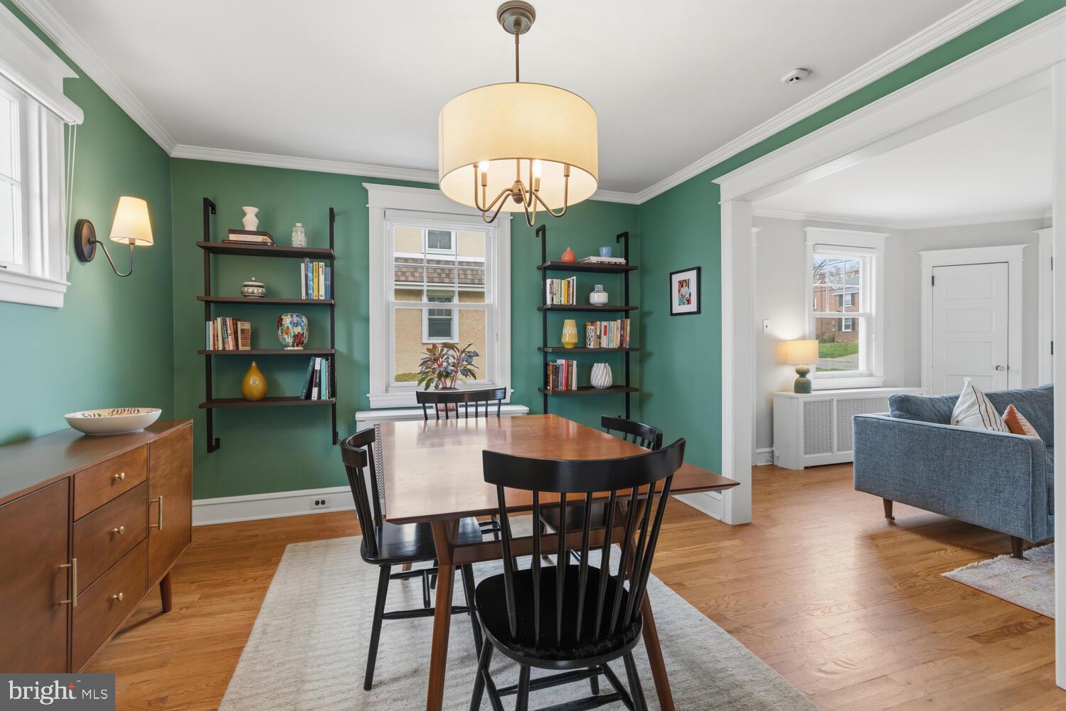 2116 East County Line Road Ardmore, PA 19003 - Photo 12 of 38 a view of a dining room with furniture a rug and wooden floor