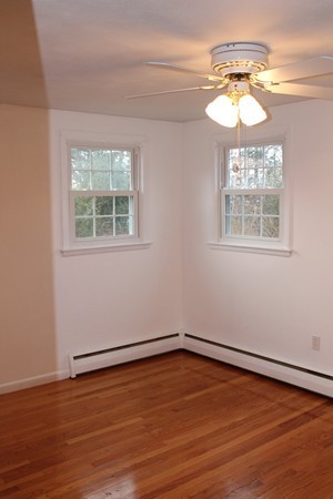 280 Forest Hills Road Springfield, MA 01128 - Photo 16 of 23 an empty room with wooden floor and windows