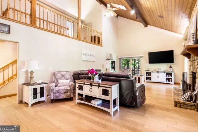 a view of a dining room with furniture and a chandelier