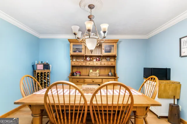 a kitchen with stainless steel appliances granite countertop a sink dishwasher stove and refrigerator with wooden floor