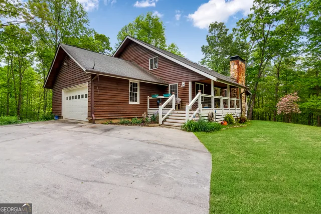 a bathroom with a sink a toilet and a shower curtain