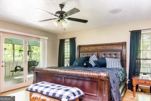 a view of a patio with table and chairs and wooden floor