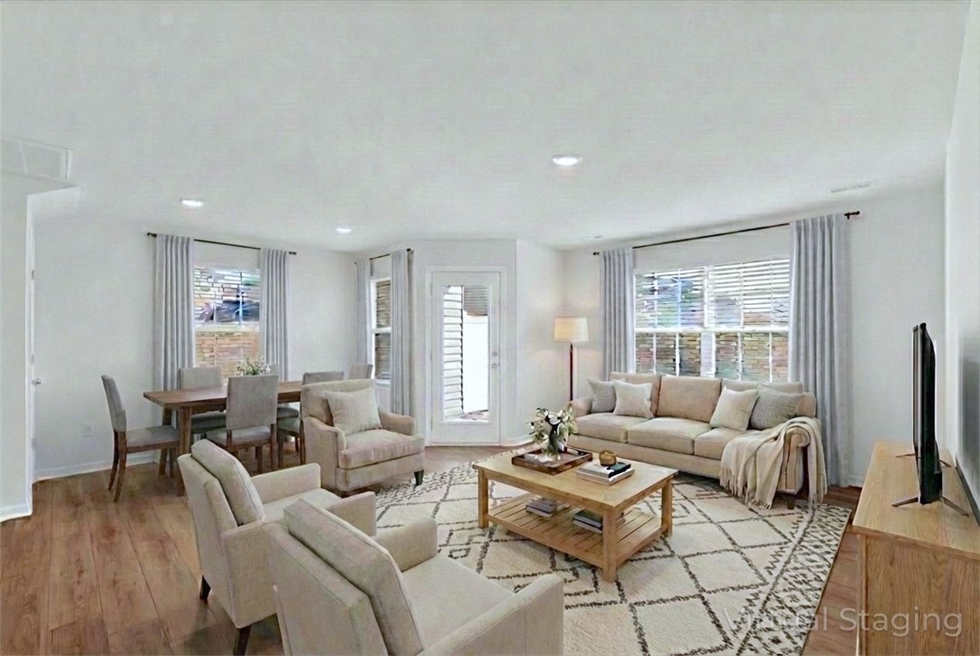 515 Brasstown Court Pendleton, SC 29670 - Photo 2 of 25 Virtually staged, this bright, inviting living space features warm LVP floors and ample natural light for both dining and socializing in everyday comfort.