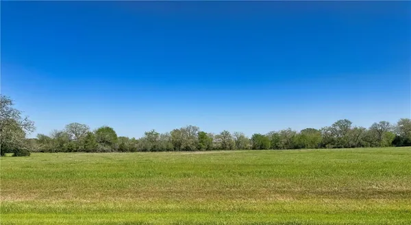 a view of a field with an outdoor space