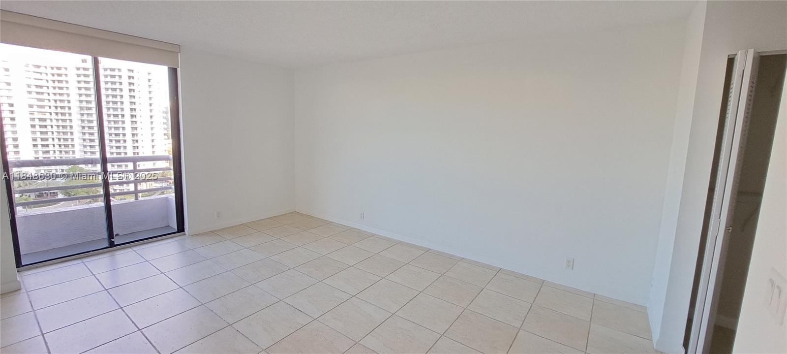 3300 Northeast 191st Street, Unit 1207 Aventura, FL 33180 - Photo 12 of 33 an empty room with windows
