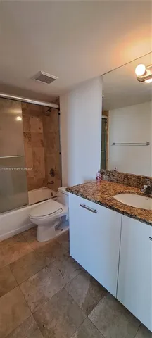 a view of an swimming pool with a yard and plants