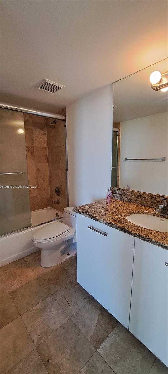 3300 Northeast 191st Street, Unit 1207 Aventura, FL 33180 - Photo 18 of 33 a bathroom with a granite countertop sink and a mirror