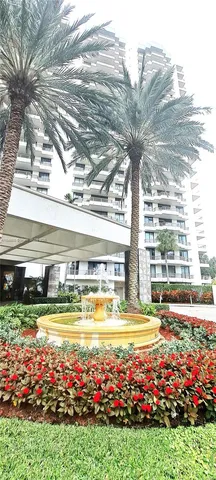 a view of swimming pool with outdoor seating and city view