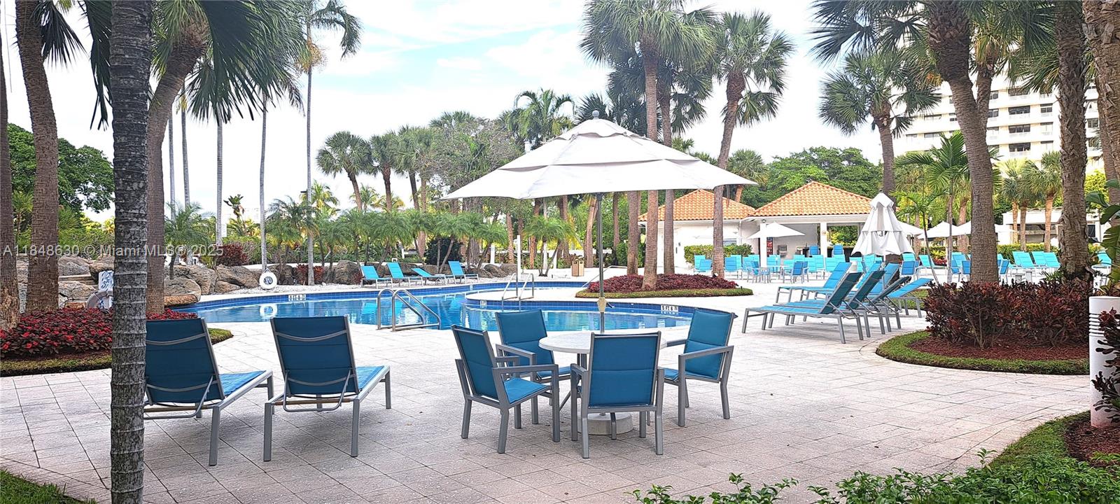3300 Northeast 191st Street, Unit 1207 Aventura, FL 33180 - Photo 23 of 33 a view of a dinning table and chairs in patio