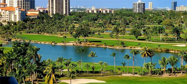 an aerial view of a house with a yard basket ball court and outdoor seating