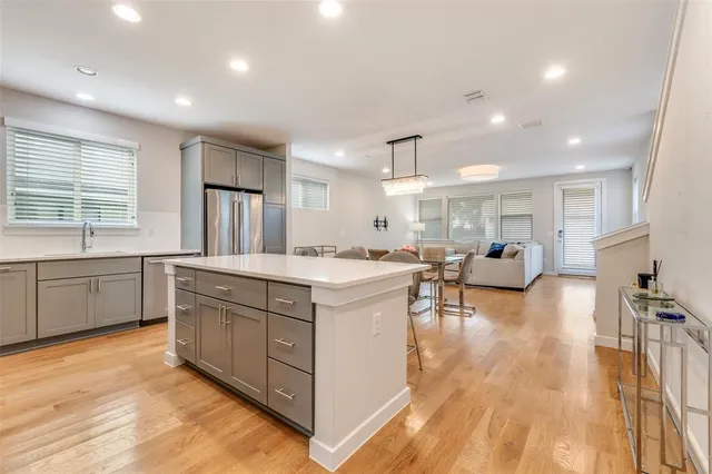 a large kitchen with stainless steel appliances lots of counter top space
