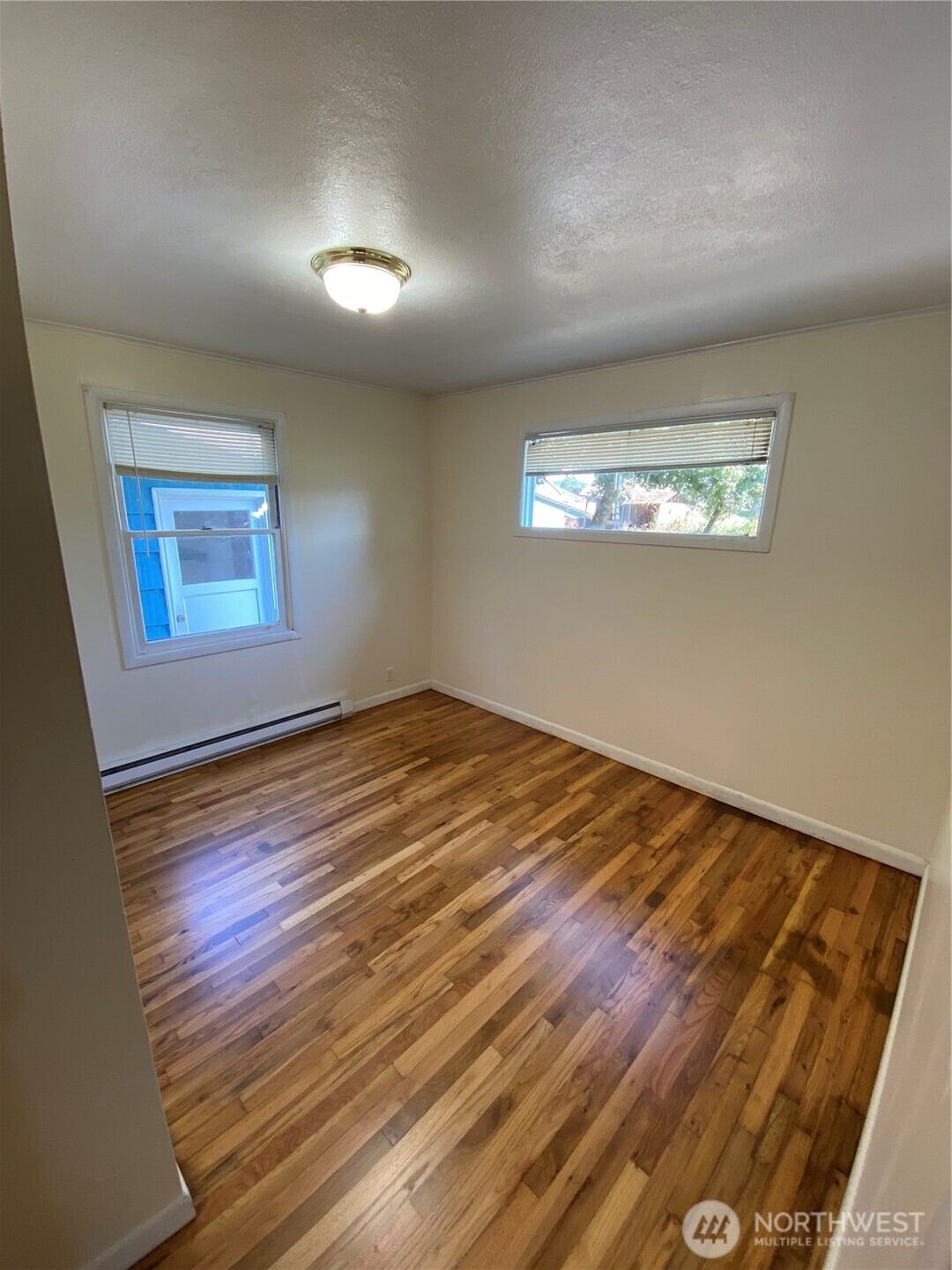 2312 38th Avenue Longview, WA 98632 - Photo 14 of 36 a view of empty room with wooden floor