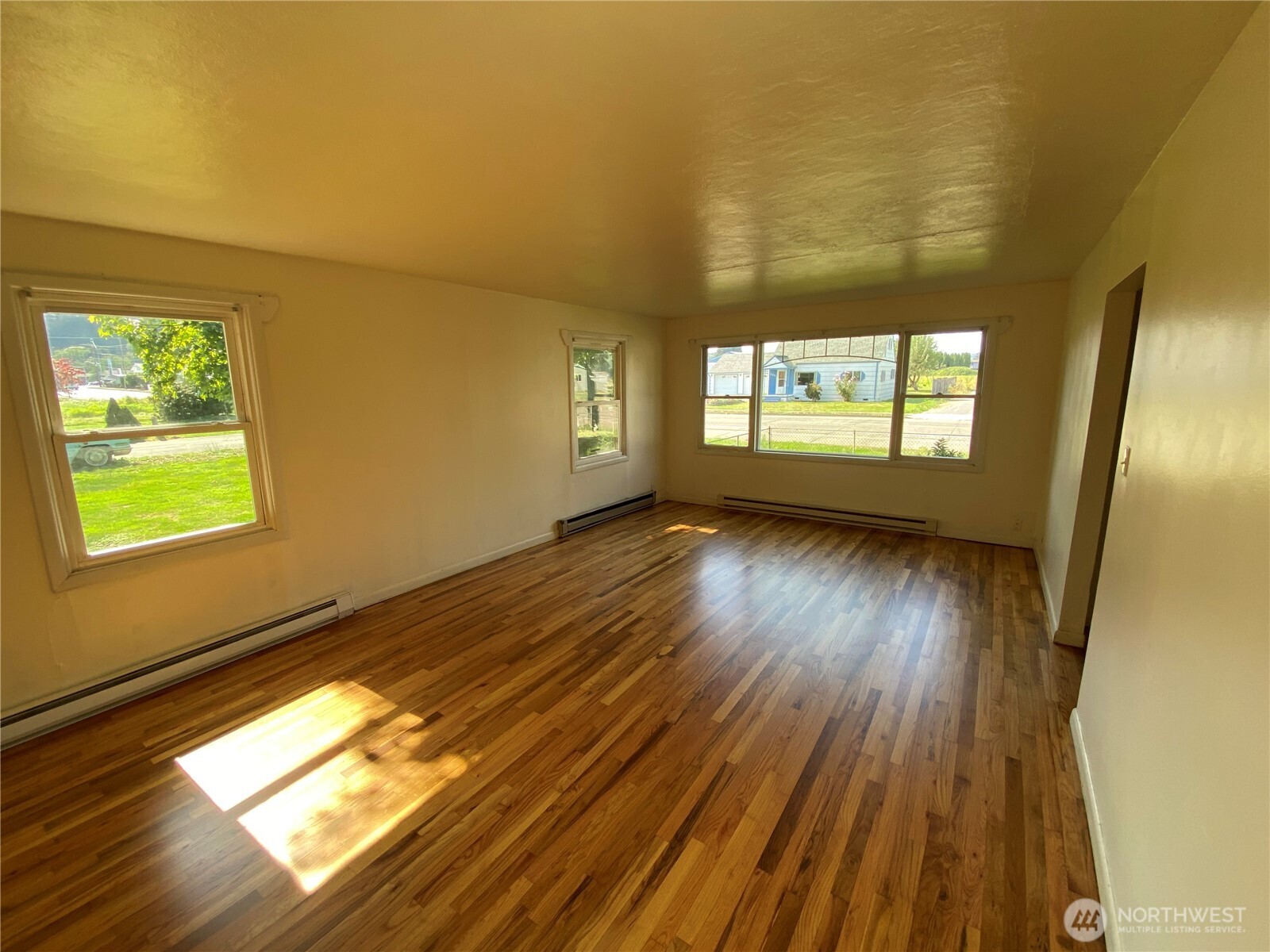 2312 38th Avenue Longview, WA 98632 - Photo 10 of 36 a view of empty room with wooden floor and fan