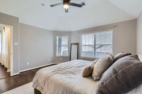 a bedroom with a bed and window