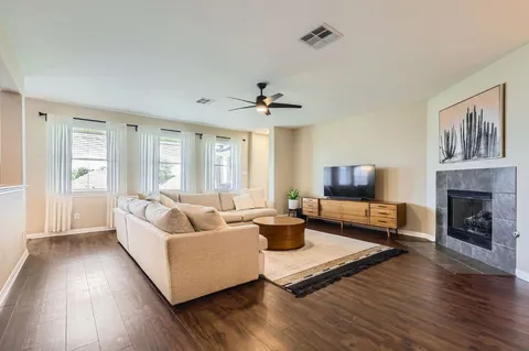 a living room with furniture and a fireplace