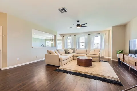 a living room with furniture and a large window