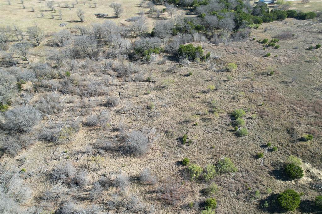 2045 Canyon Wren Loop Graford, TX 76449 - Photo 1 of 32 a view of a dry yard with green space