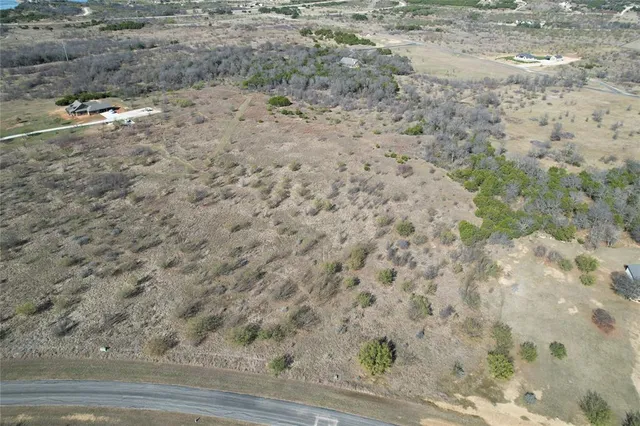 a view of a dry yard with wooden floor