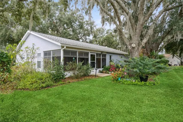 a view of a house with garden and yard