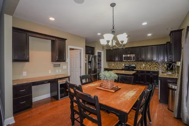 a dining room with furniture and window