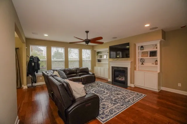 a bath tub sitting next to a white sink