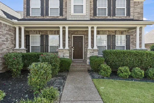 an aerial view of a house with swimming pool and outdoor space