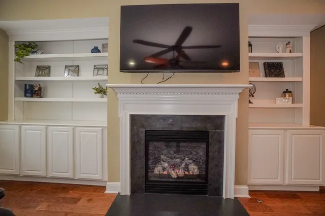 a spacious bathroom with a tub sink and mirror