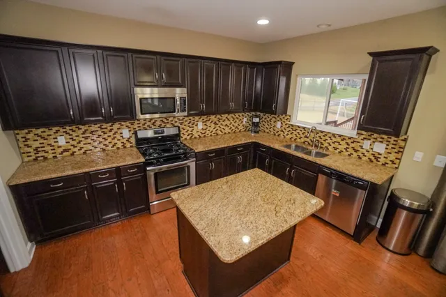 a bedroom with a bed and couch