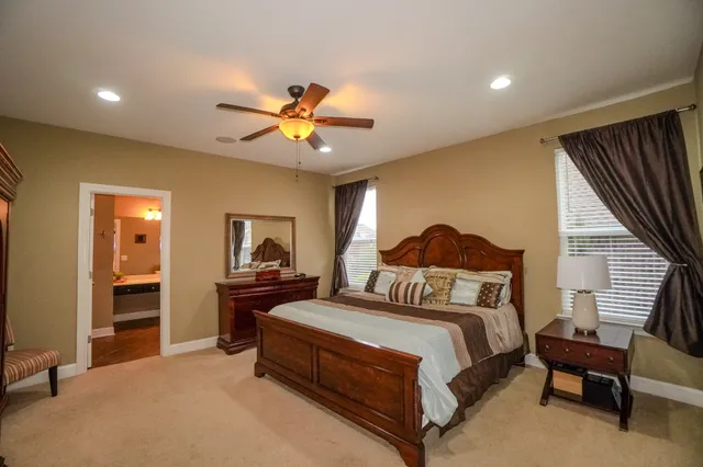 a roof deck with table and chairs