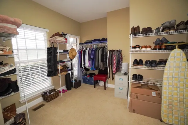 a balcony with table and chairs