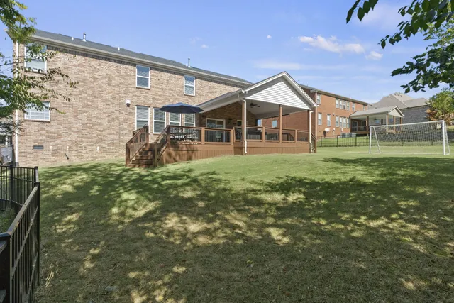 a living room with furniture fireplace and flat screen tv