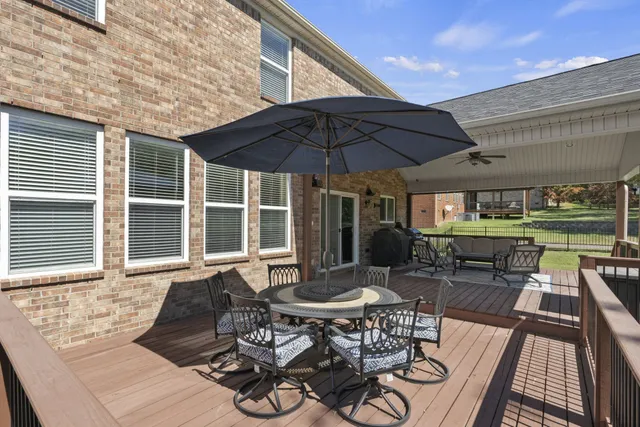 a living room with furniture fireplace and flat screen tv