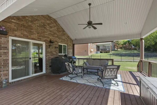 a living room with furniture and a rug