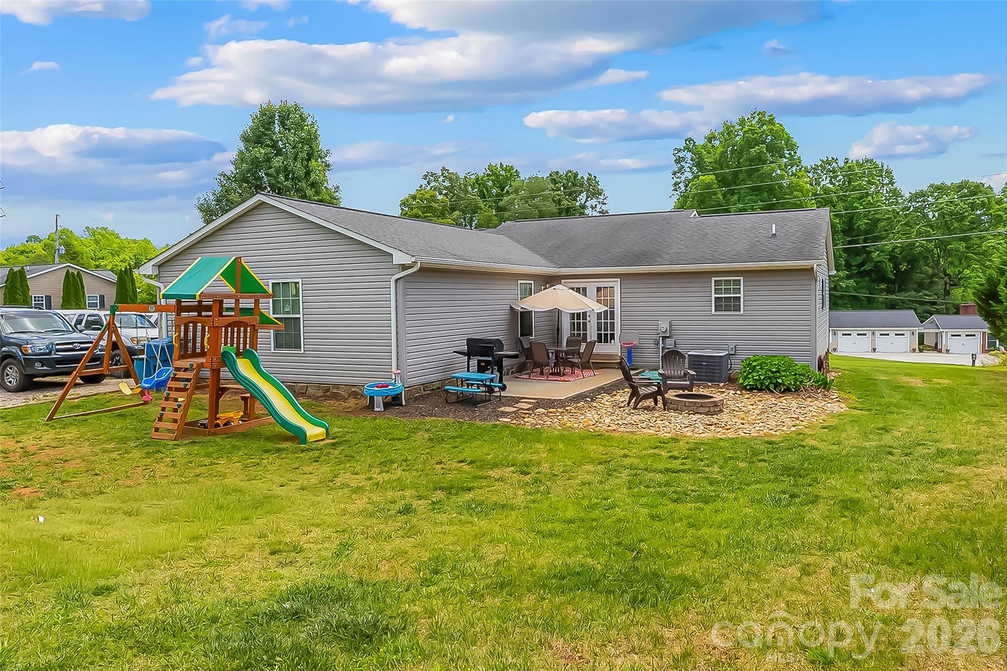 1498 Salem Road Morganton, NC 28655 - Photo 26 of 32 a view of a house with swimming pool and sitting area