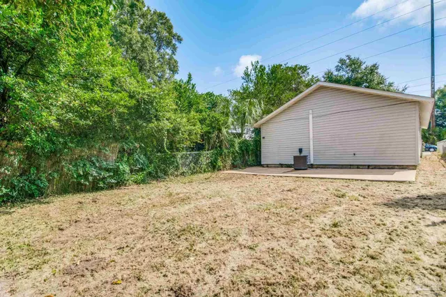 a view of house with wooden fence