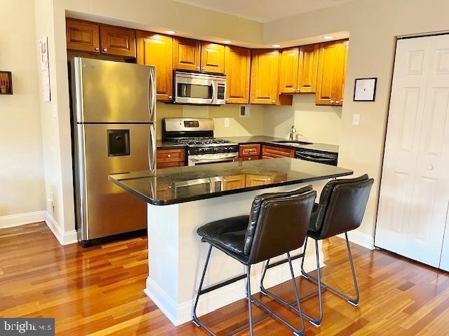 2101 Chestnut Street, Unit 517 Philadelphia, PA 19103 - Photo 3 of 15 a kitchen with stainless steel appliances granite countertop a refrigerator and a stove top oven