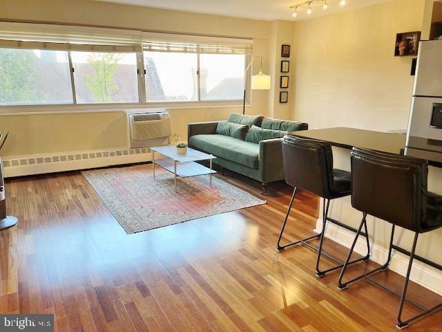 2101 Chestnut Street, Unit 517 Philadelphia, PA 19103 - Photo 6 of 15 a living room with furniture and a large window