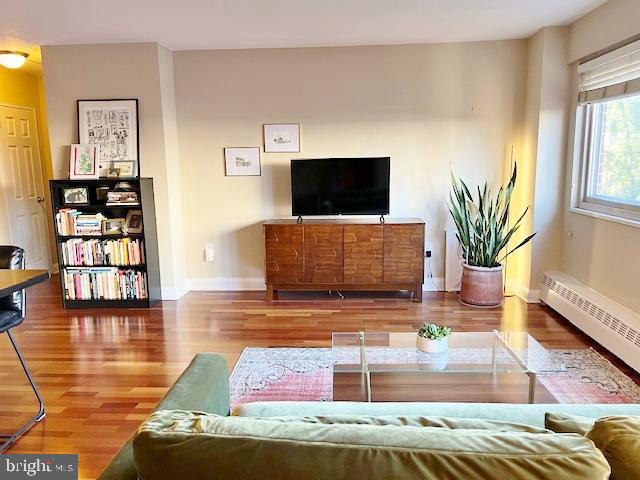 2101 Chestnut Street, Unit 517 Philadelphia, PA 19103 - Photo 7 of 15 a living room with furniture and a flat screen tv