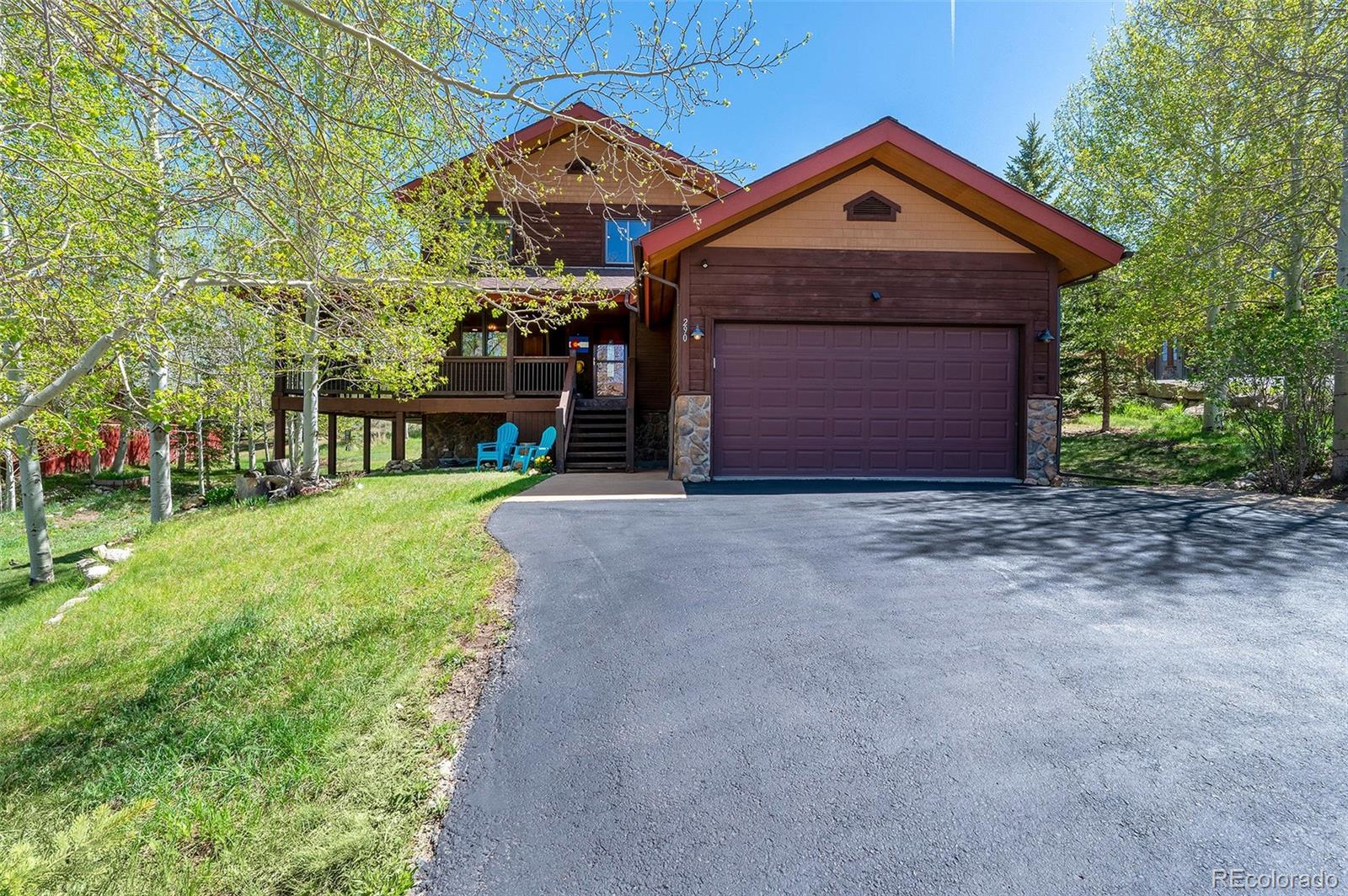 290 Village Road Granby, CO 80446 - Photo 1 of 45 a front view of a house with a yard