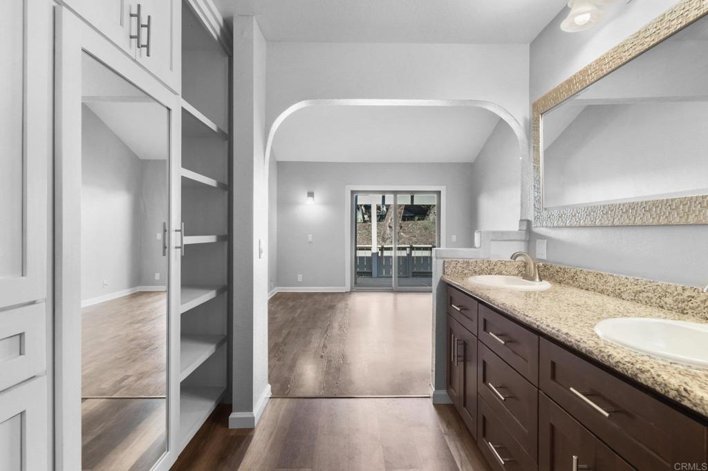 5667 Adobe Falls Road, Unit C San Diego, CA 92120 - Photo 23 of 40 a view of a kitchen cabinets and a counter place
