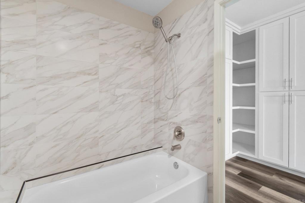 5667 Adobe Falls Road, Unit C San Diego, CA 92120 - Photo 25 of 40 a bathroom with a bathtub
