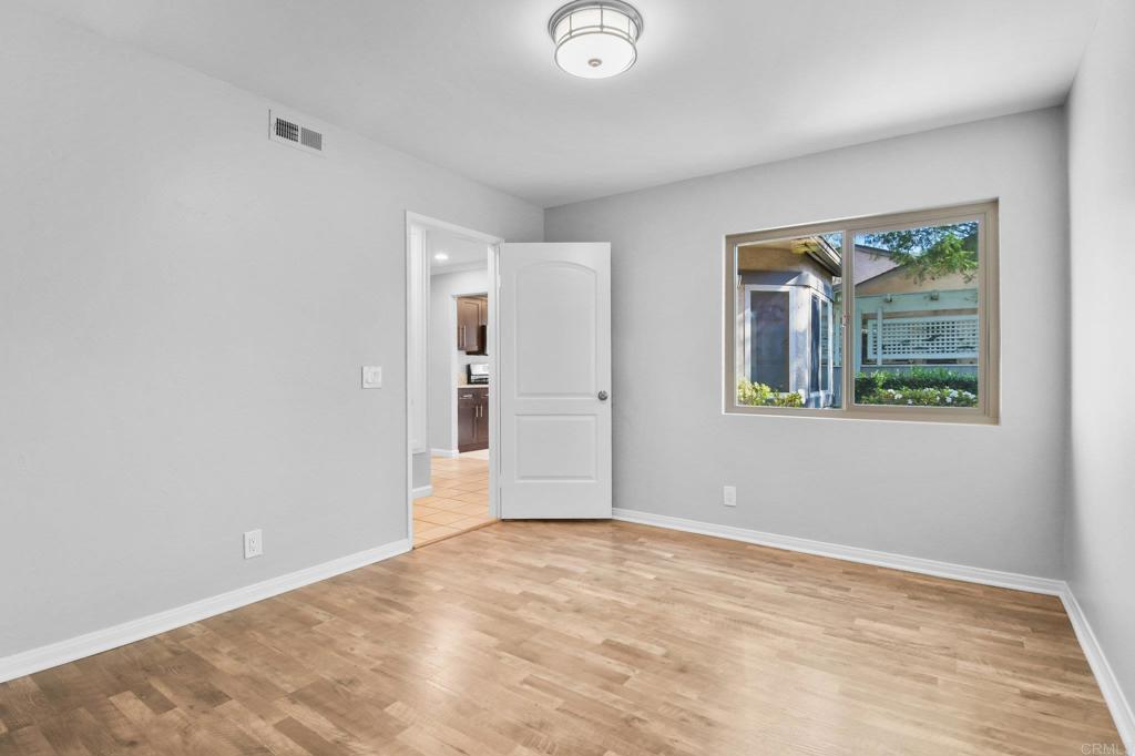 5667 Adobe Falls Road, Unit C San Diego, CA 92120 - Photo 26 of 40 a view of an empty room with window and closet area