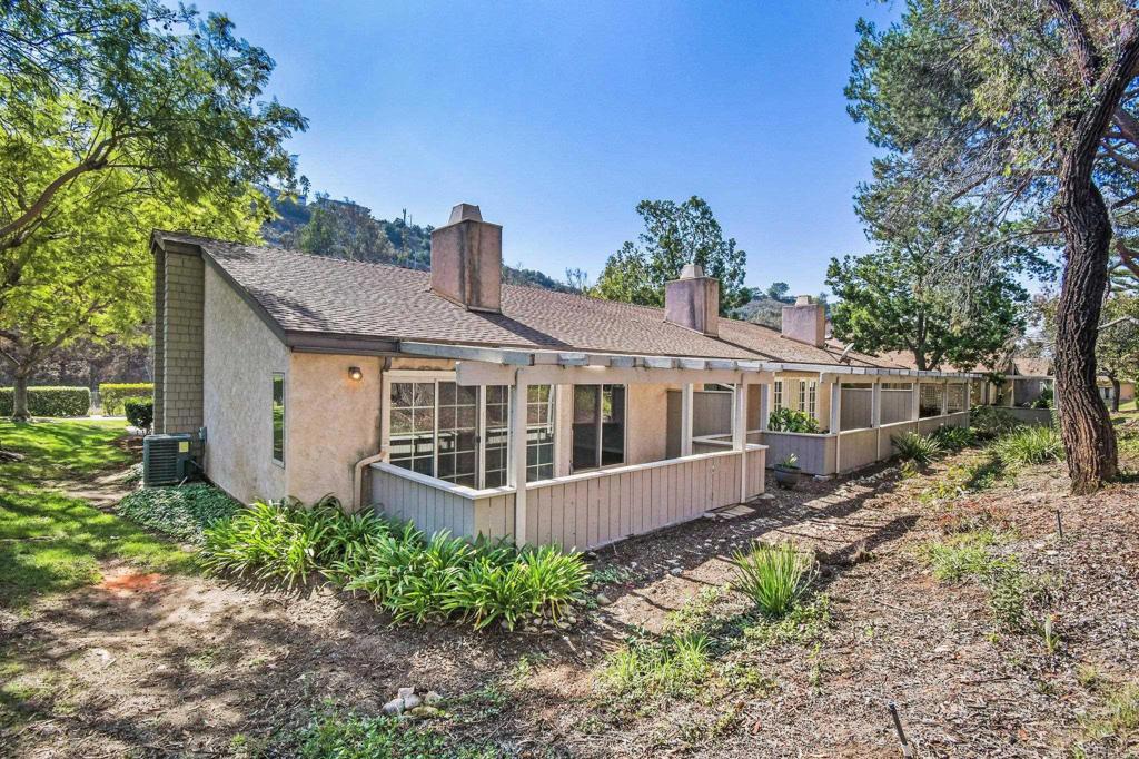 5667 Adobe Falls Road, Unit C San Diego, CA 92120 - Photo 35 of 40 a front view of a house with a garden